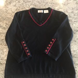 Size L black cotton top with red details.